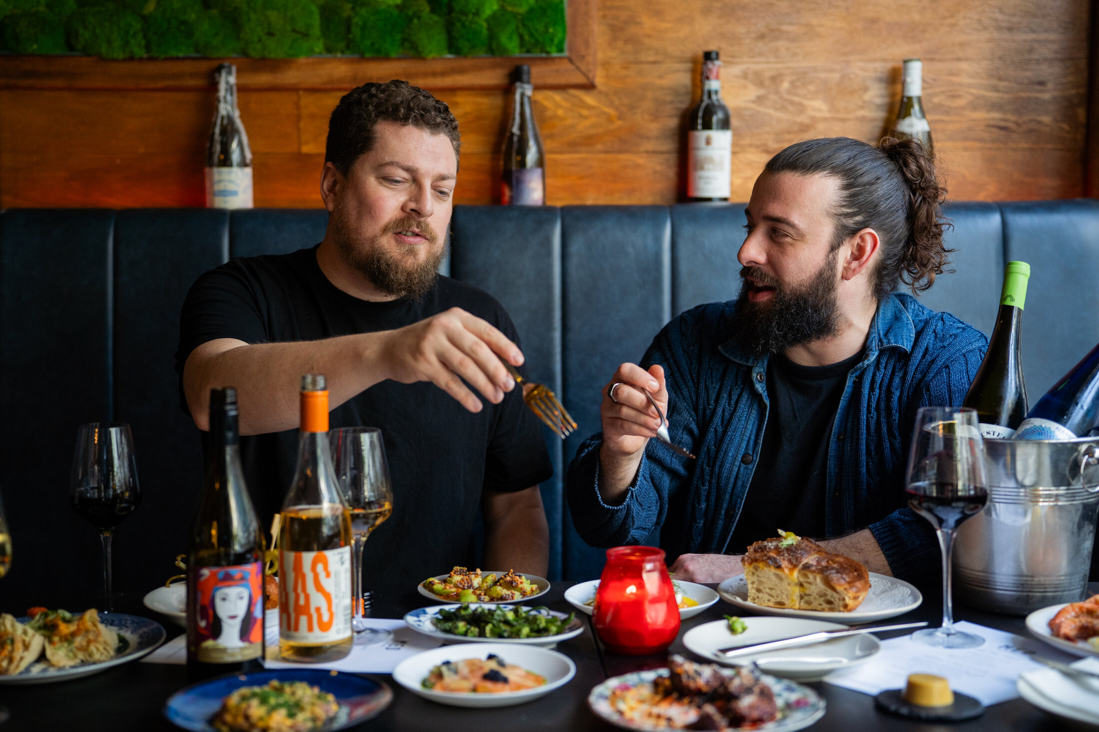 Will Dennard and Jack Southan sharing food at a table